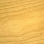 A close up of the wood grain on a table.