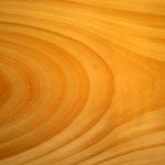 A close up of the wood grain on a table.