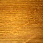 A close up of the wood grain on a table.