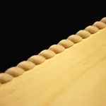 A close up of the edge of a guitar