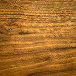 A close up of the wood grain on a table.