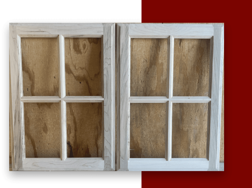 Two windows with a wooden frame on the outside.